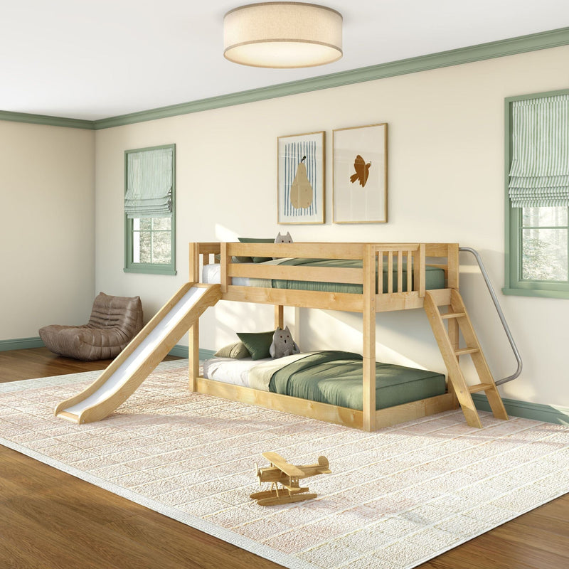 Wooden bunk bed with slide in a bright kids' bedroom with green bedding, striped Roman shades, framed wall art and a wooden toy airplane