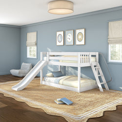White children's bunk bed with slide and ladder in a light-blue kids' bedroom, twin-over-twin striped bedding, jute rug and framed wall art