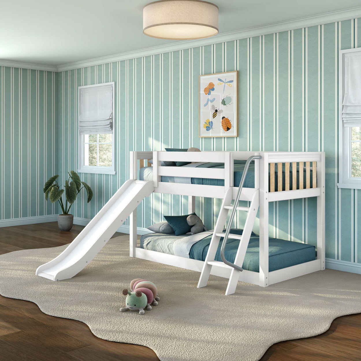 White wooden twin bunk bed with slide and ladder in bright teal-striped children's bedroom, cozy rug and stuffed caterpillar toy, modern kids' room decor