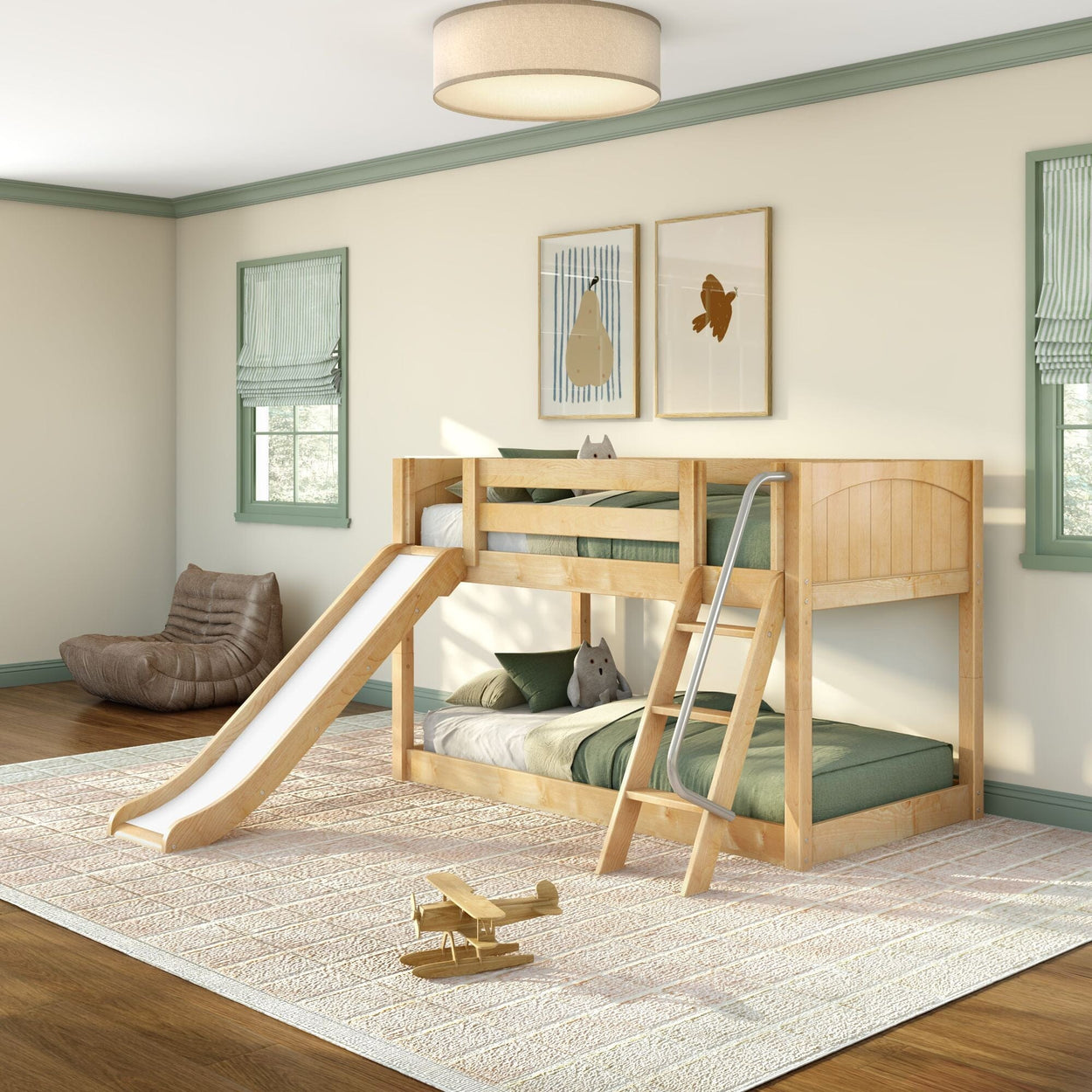 Natural wood twin loft bunk bed with slide and ladder in a bright kids' bedroom with green bedding, plush toys, and wooden airplane toy