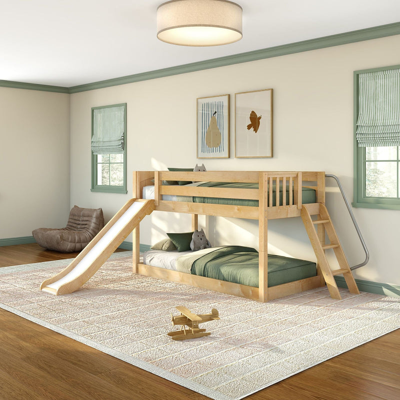 Kids' room with wooden bunk bed and slide, green bedding, framed art, striped shades and wooden toy airplane on rug.
