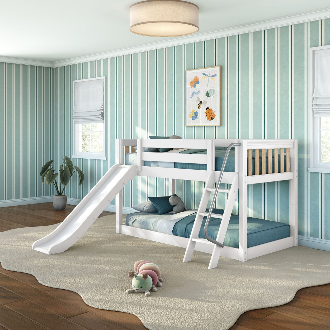 Modern white wooden kids bunk bed with slide and ladder in teal-striped children's bedroom, teal bedding, hardwood floors, plush caterpillar toy, framed wall art