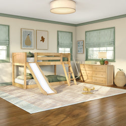 Kids bedroom with wooden bunk bed and slide, green-striped window treatments, matching wooden dresser, woven basket and toy airplane on area rug over hardwood floor