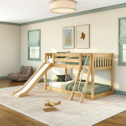 Wooden twin bunk bed with slide and ladder, green bedding, plush toys and wooden airplane in bright kids' bedroom