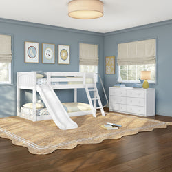 Children's bedroom with white twin-over-twin bunk bed and slide, blue walls, natural woven jute rug, white dresser and nautical decor
