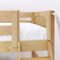Close-up of natural pine bunk bed with built-in ladder and white mattress — solid wood children's loft bed detail