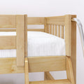 Close-up of natural solid pine bunk bed with safety rails, ladder and white mattress — modern wooden twin loft bed for kids' bedroom