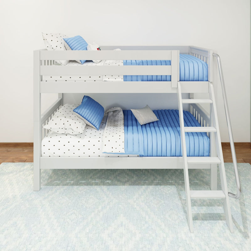 White wooden bunk bed with blue quilted bedding, star-print sheets and ladder in modern kids' bedroom, space-saving design