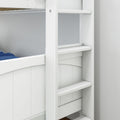 Close-up of a white wooden bunk bed ladder and guardrail with blue bedding, sturdy kids' bunk bed steps in a modern children's bedroom