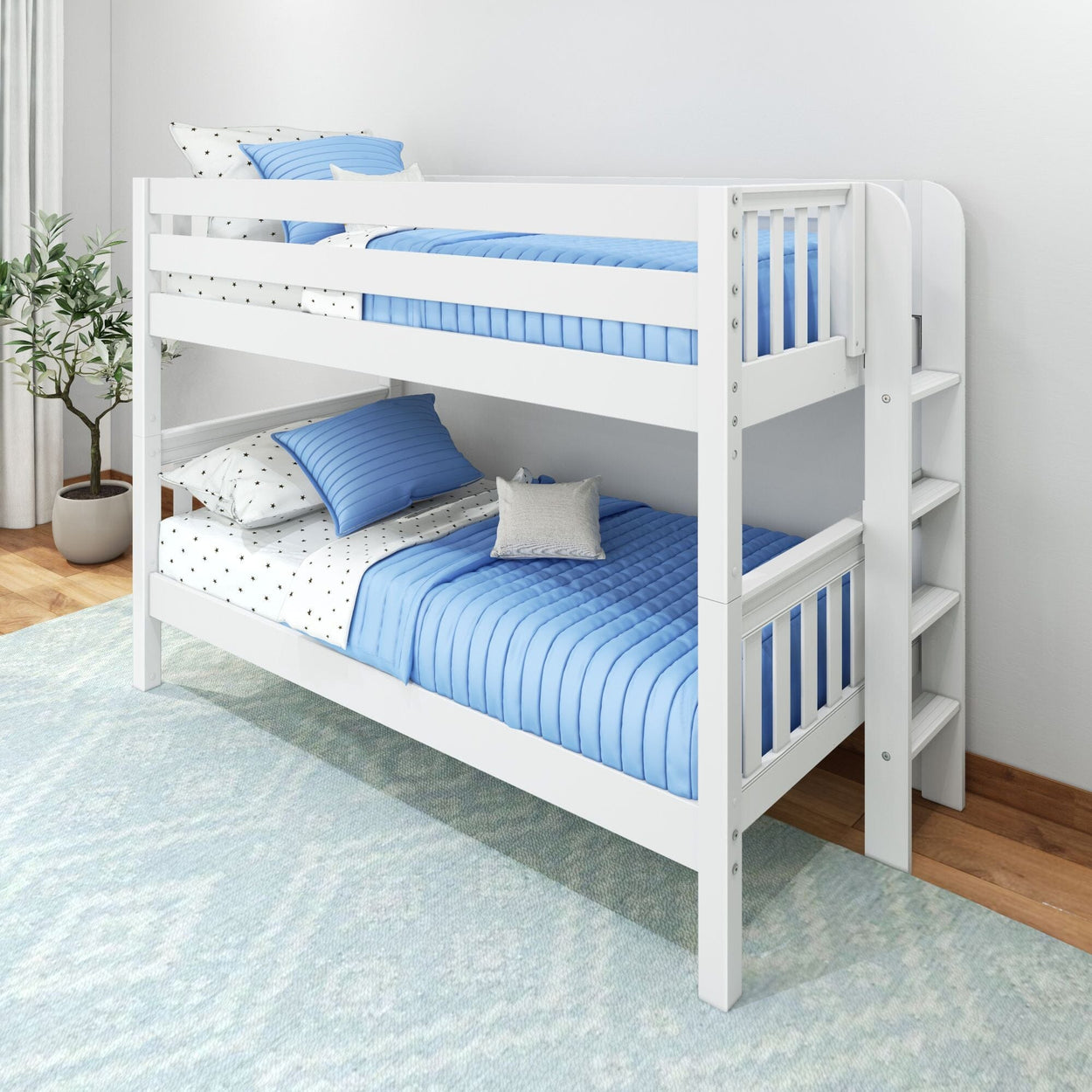 White wooden twin bunk bed with blue quilted bedding, ladder and star-print sheets in a modern kids bedroom with potted plant