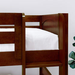 Loft bed with wooden frame and white bedding in a modern bedroom setting.