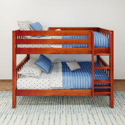 Wooden bunk bed with blue bedding and polka dot sheets in a modern bedroom setting.