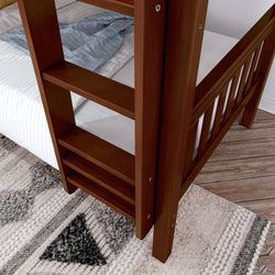 Wooden bunk bed ladder with comfortable bedding and stylish carpet on wooden floor.
