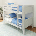 White wooden twin bunk bed with ladder, blue quilted bedding and star-patterned sheets in bright kids' bedroom