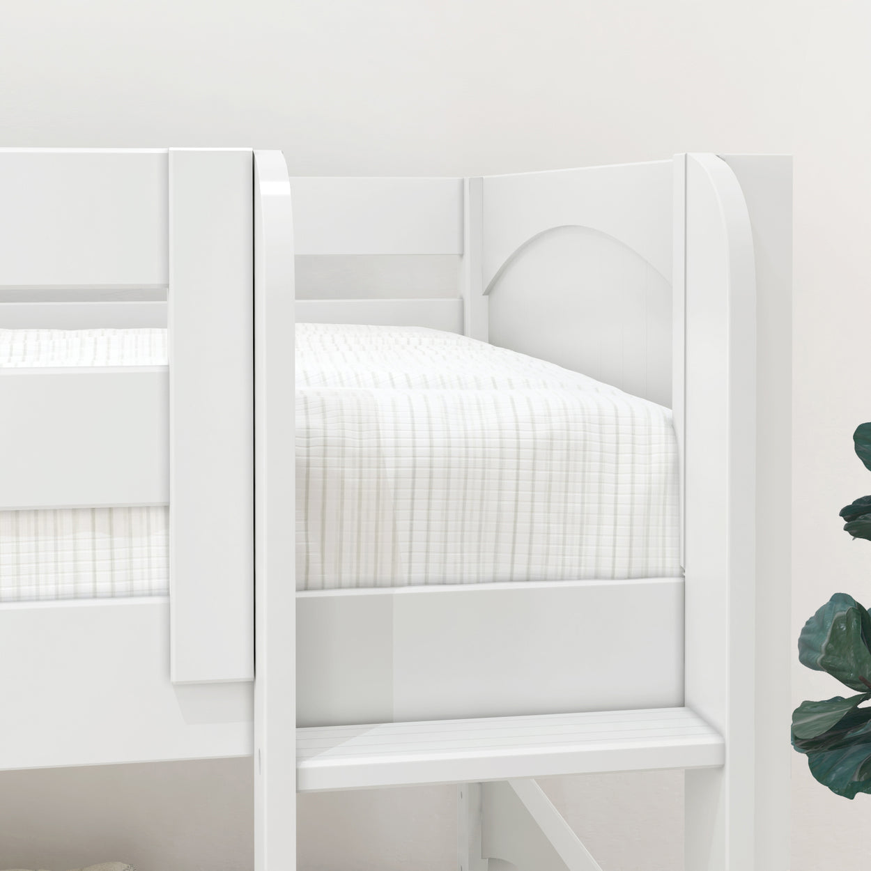 White wooden loft bed with striped bedding and ladder, next to a green plant in a light-filled room.