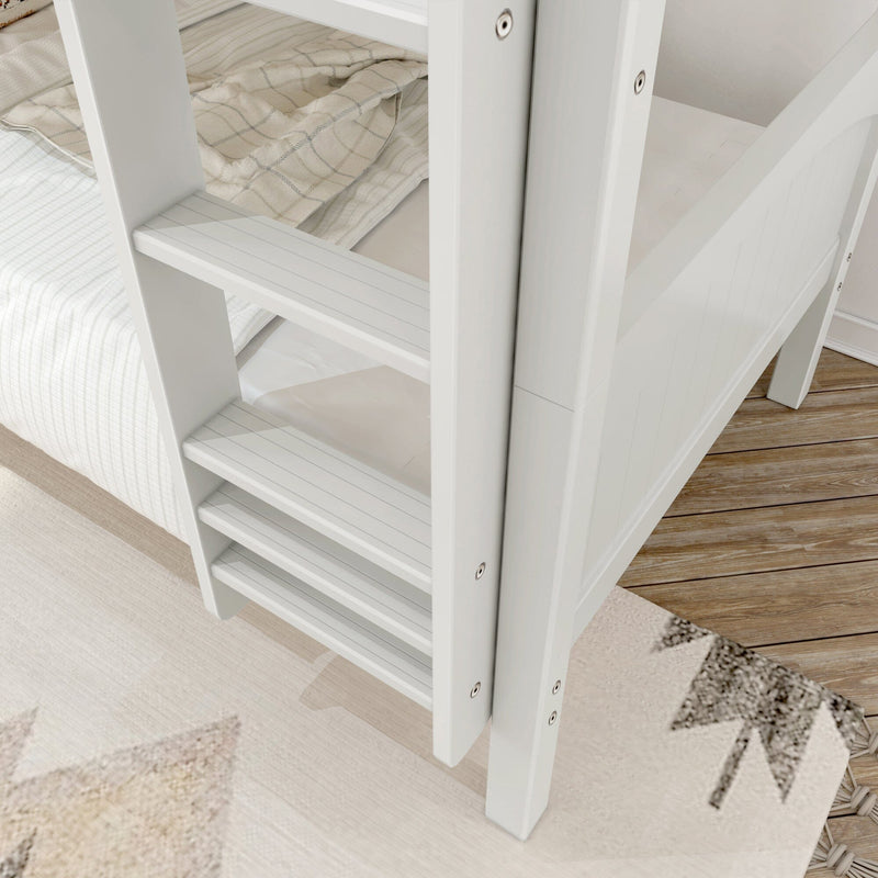 Close-up of white wooden bunk bed ladder with slatted steps, beige plaid bedding and hardwood bedroom floor