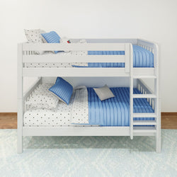 White wooden bunk bed with blue bedding and polka dot sheets in a modern children's bedroom.