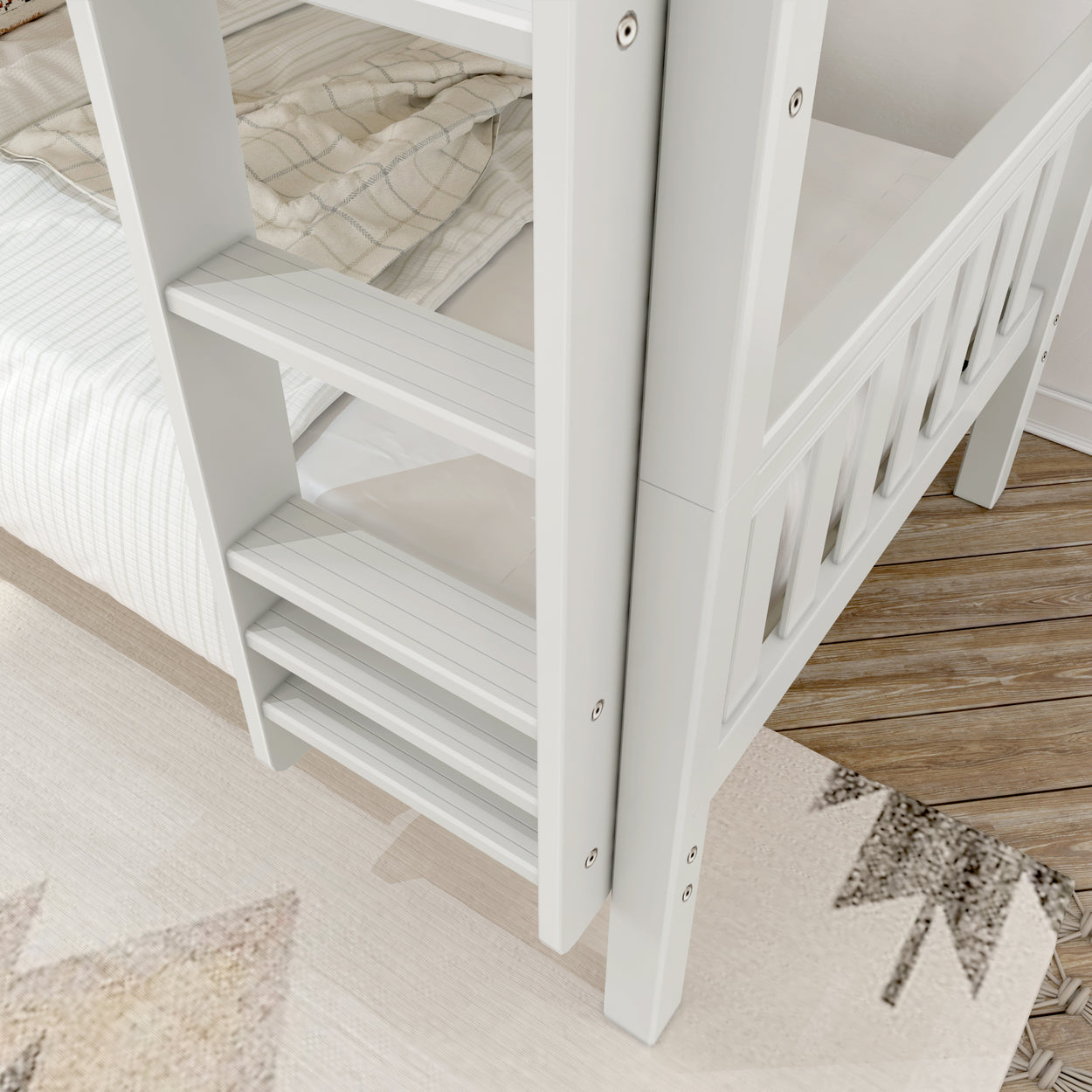 White wooden bunk bed ladder with striped bedding and wooden floor.