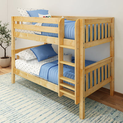Solid wood twin-over-twin bunk bed with blue quilted bedding and star-print sheets in a kids' bedroom, space-saving ladder and guardrails