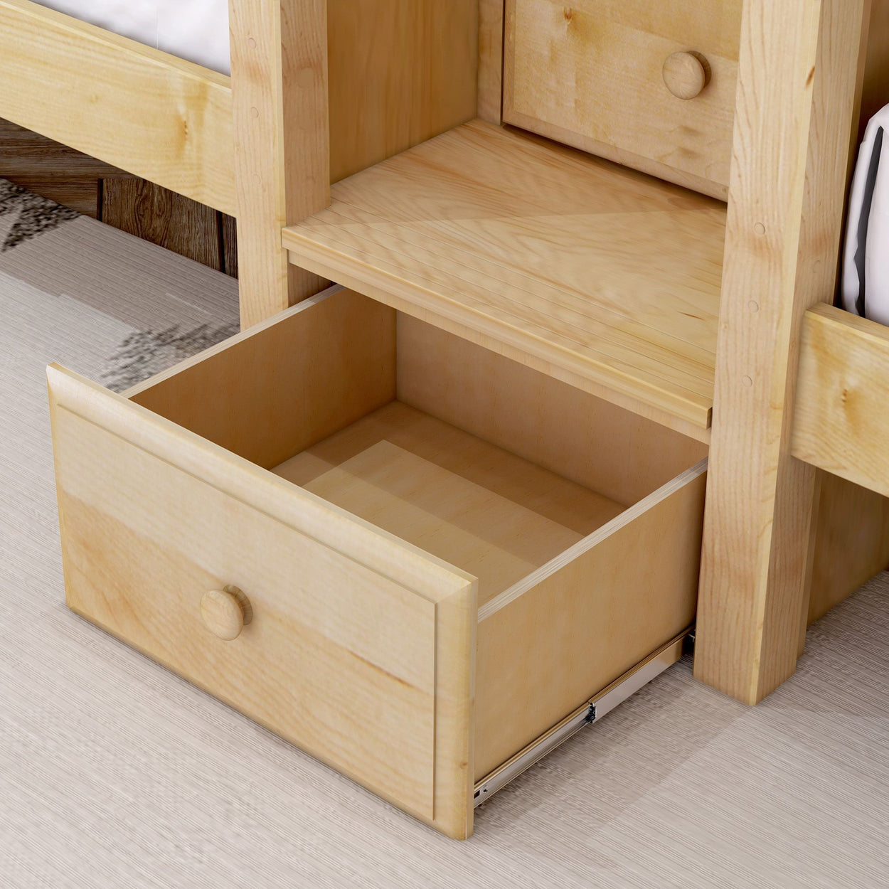 Open wooden dresser drawer in a light oak finish, ideal for bedroom storage solutions.