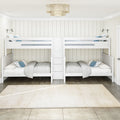 White twin-over-twin bunk beds in a coastal farmhouse kids bedroom with neutral bedding, blue accent pillows, wall-mounted reading lamps, beige vertical shiplap walls and a woven ceiling pendant light
