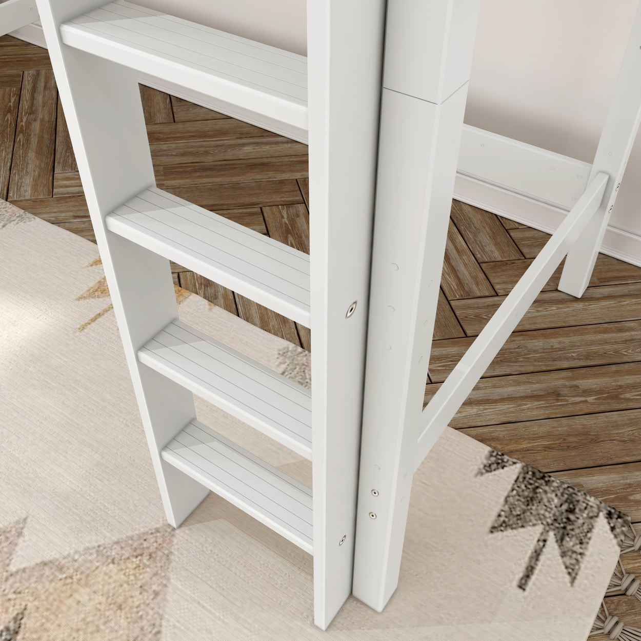 White wooden ladder in a modern bedroom with parquet flooring and geometric rug design.