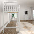 White loft bed in a modern minimalist bedroom with white bedding, potted plant, white dresser, neutral curtains, herringbone hardwood floor and geometric rug