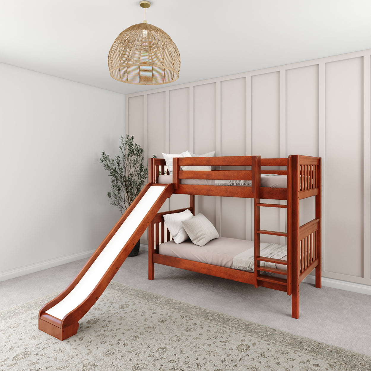 Wooden bunk bed with slide in modern kids' room with a rug and a hanging lamp.