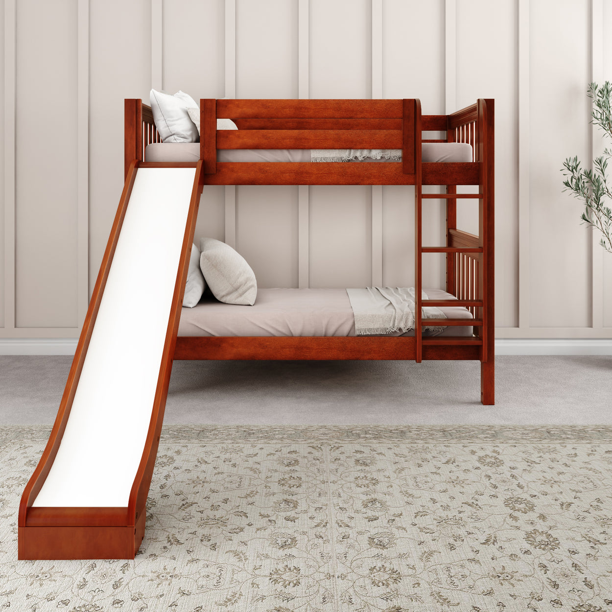 Wooden bunk bed with slide and two beds in a cozy bedroom setting with a patterned rug.