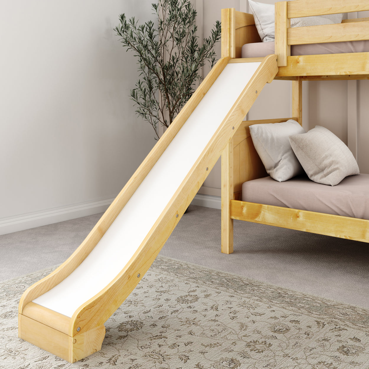 Wooden bunk bed with slide and cozy pillows in a children's bedroom.