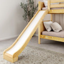 Wooden bunk bed with slide and cozy pillows in a children's bedroom.