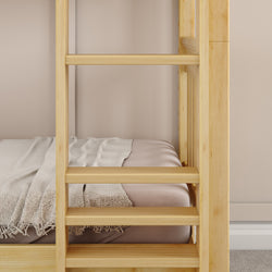 Wooden bunk bed with comfortable bedding and neutral decor in a cozy room.