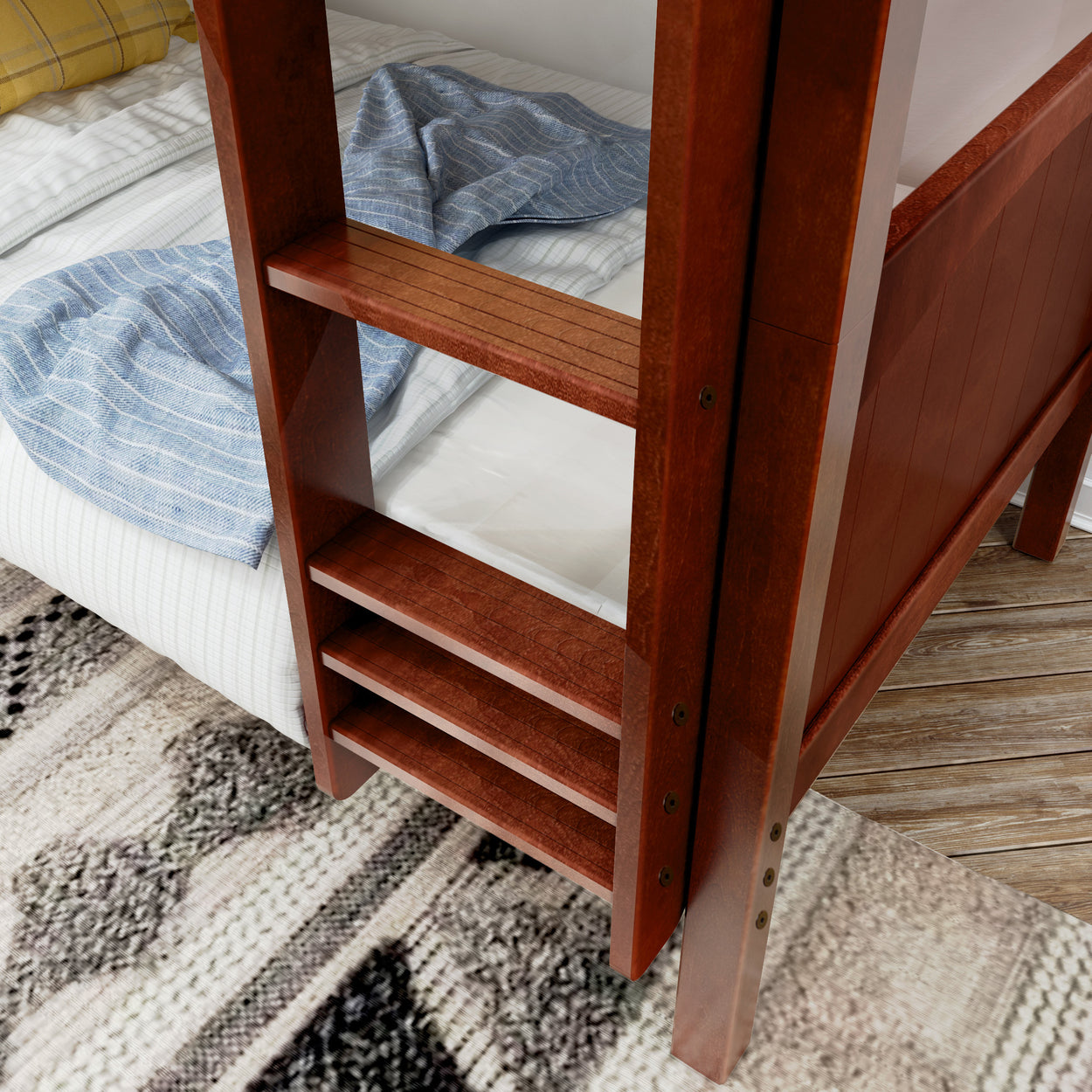 Wooden bunk bed ladder beside cozy plaid bedding in a modern bedroom with patterned rug.