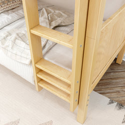 Wooden bunk bed ladder with cozy bedding, ideal for small spaces.