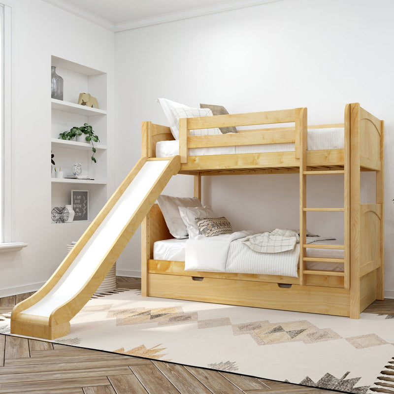Natural pine wooden bunk bed with slide and ladder in bright modern kids' bedroom with storage drawer and white bedding