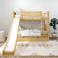 Natural wood twin-over-twin bunk bed with slide and under-bed storage in a bright kids' bedroom with white bedding, geometric rug and potted plant