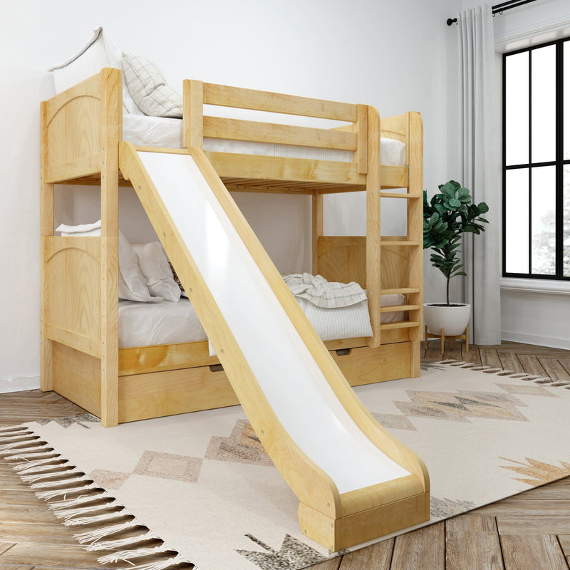 Kids wooden bunk bed with slide and ladder, natural finish with under-bed storage drawers and white bedding in a bright modern bedroom