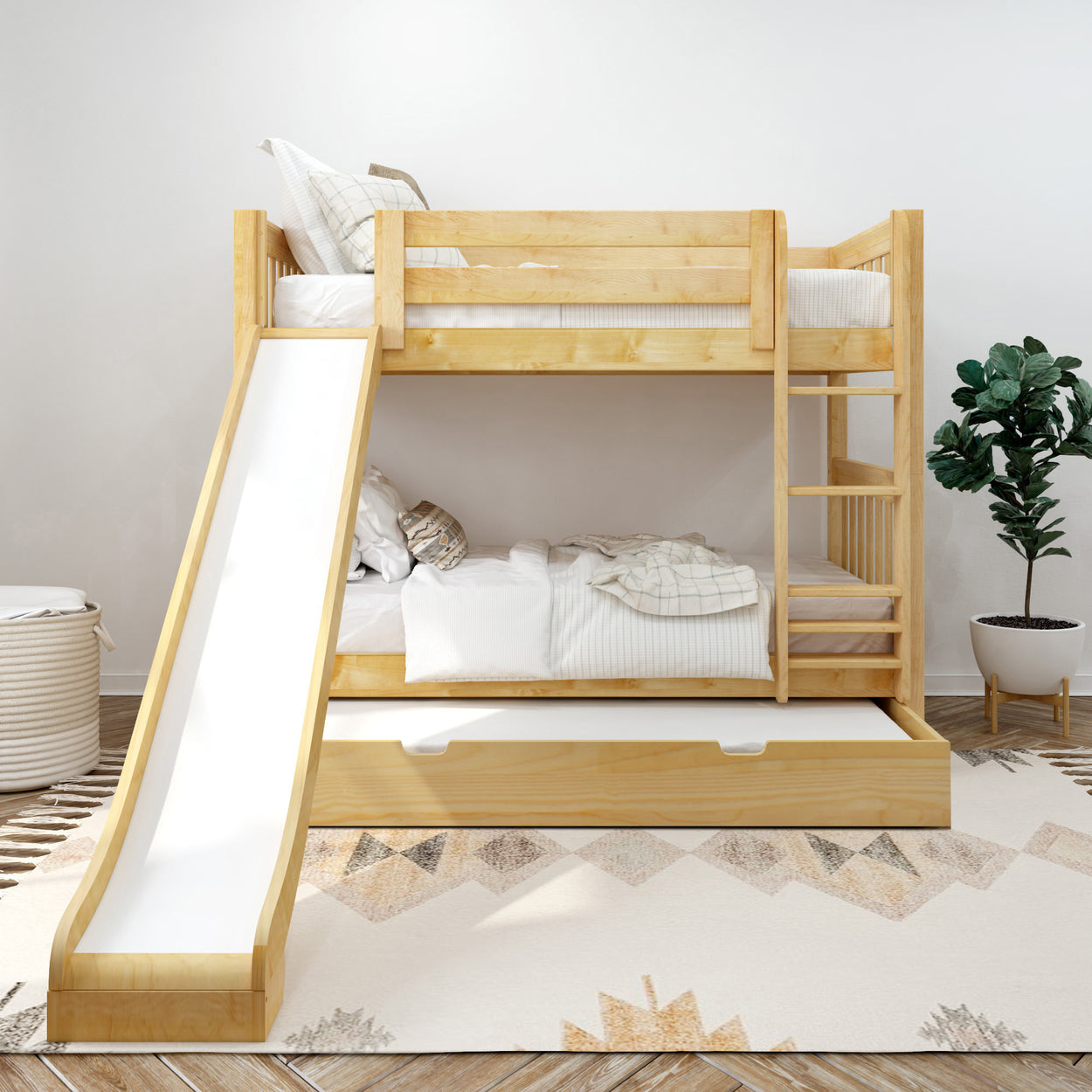 Bunk bed with slide in modern children's room featuring light wood, cozy bedding, and storage space.