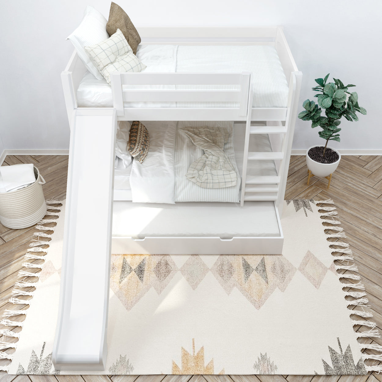 White bunk bed with slide in modern children's room featuring cozy bedding, decorative plants, and geometric rug.
