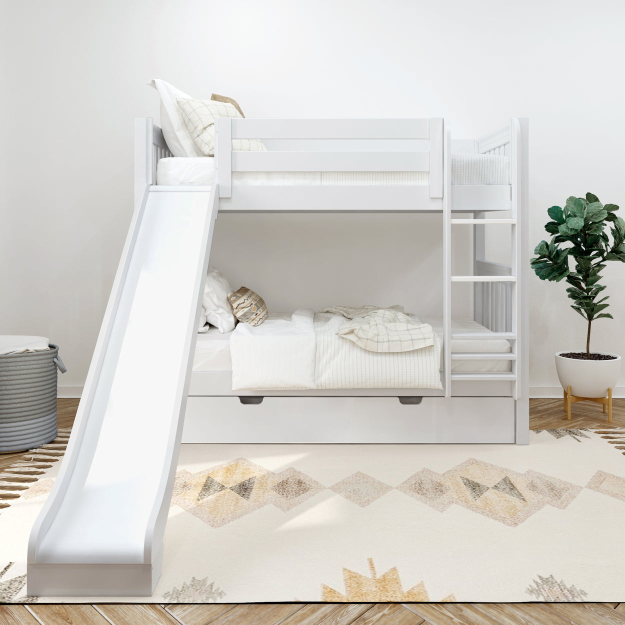 White children's bunk bed with slide and ladder in a modern bedroom with potted plant.