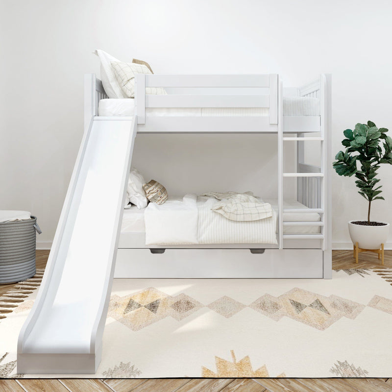Modern white twin bunk bed with slide and ladder, under-bed storage drawer in neutral children's bedroom with patterned rug and potted plant