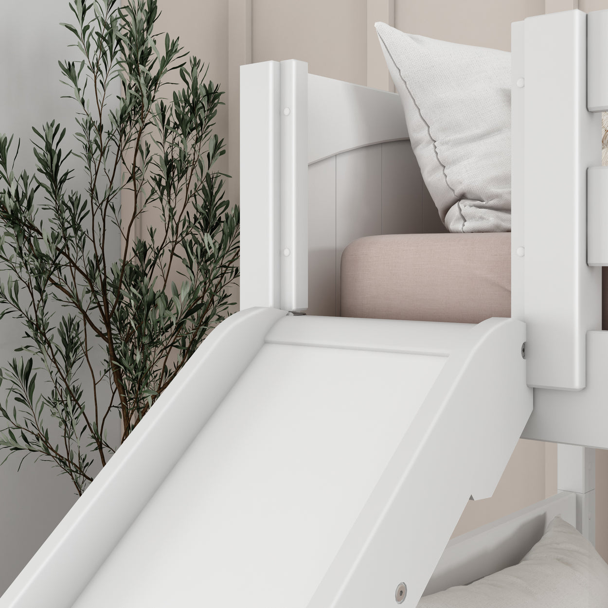 White loft bed with slide and cushions in a modern children's bedroom with green plant decor.