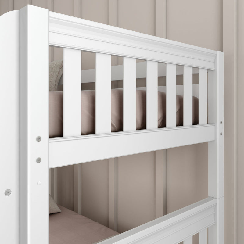 Close-up of white wooden bunk bed slats and guardrail with beige bedding against a beige paneled wall