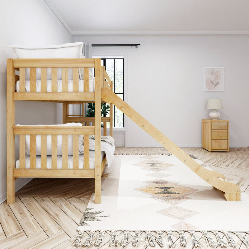Wooden bunk bed with built-in ladder and slide in a bright neutral kids' bedroom with patterned rug, nightstand lamp and window