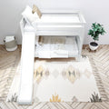 White wooden bunk bed with slide in modern kids bedroom, neutral bedding, woven storage basket, potted plant, herringbone floor