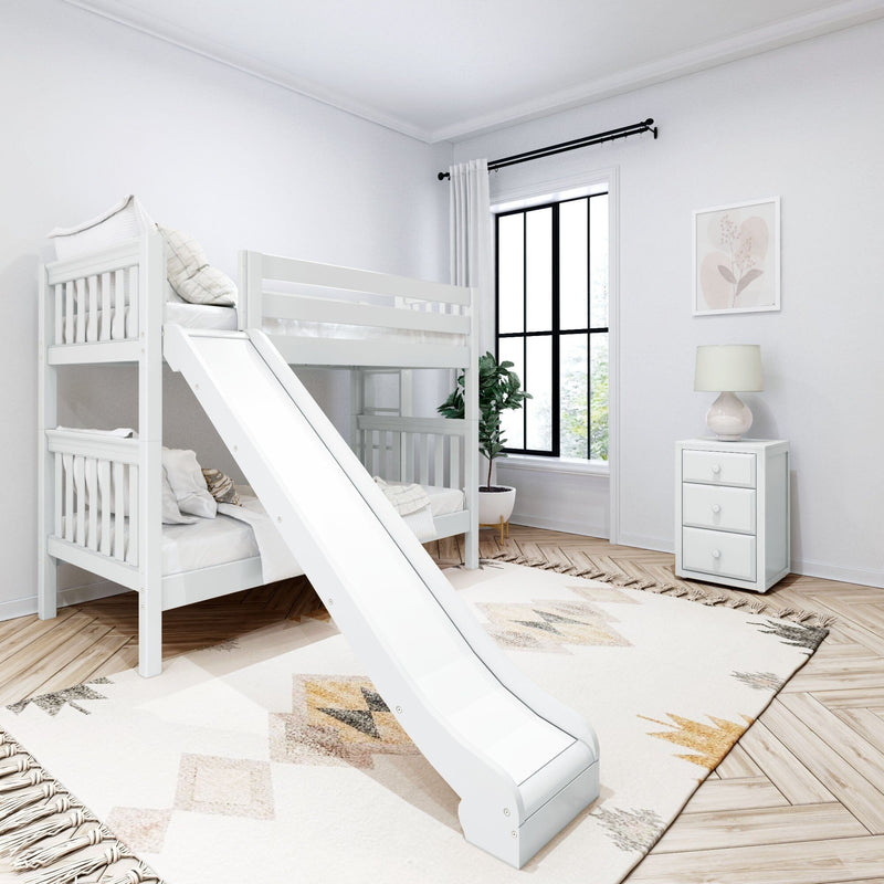 White wooden bunk bed with slide in a modern neutral children's bedroom, geometric rug, black-framed window, nightstand with lamp and potted plant