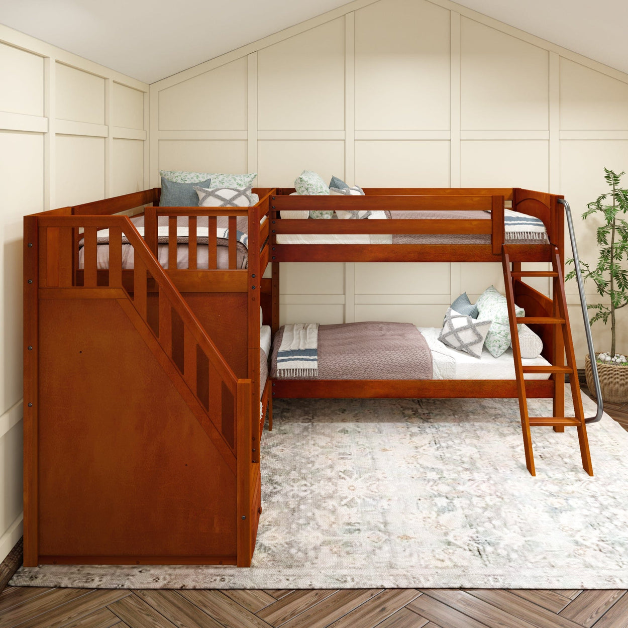 Rustic wooden bunk bed with stairs in a cozy attic room featuring soft cushions and a patterned area rug.