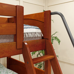 Wooden bunk bed with ladder and striped throw blanket in a cozy bedroom setting.