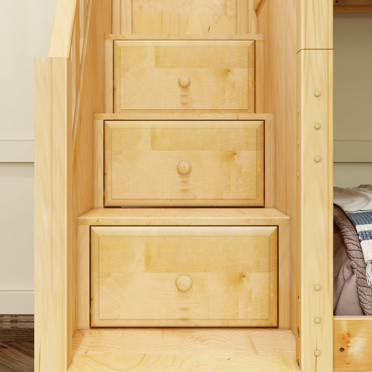 Built-in light wood staircase drawers with storage space.