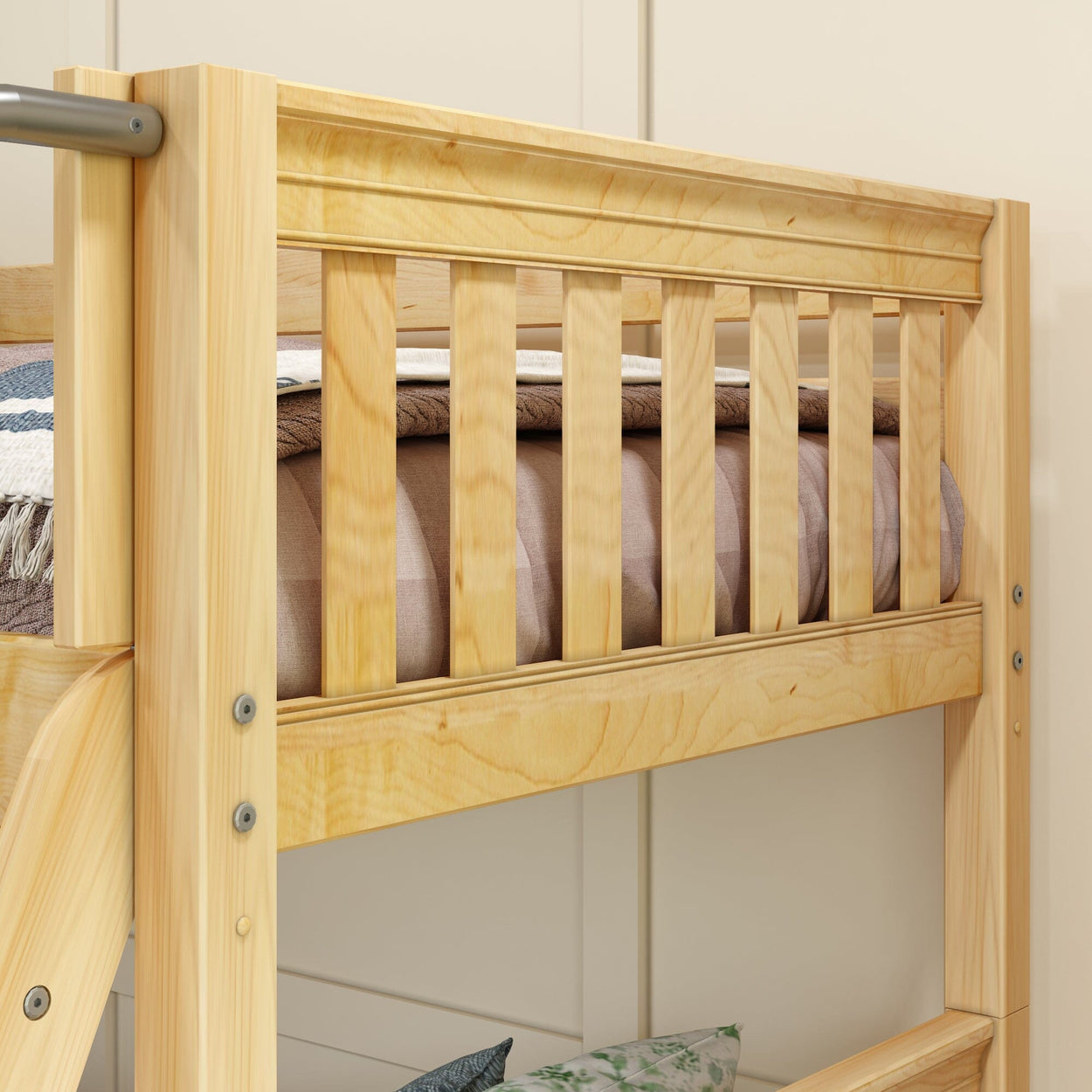 Wooden bunk bed with safety rail in a cozy bedroom setting.